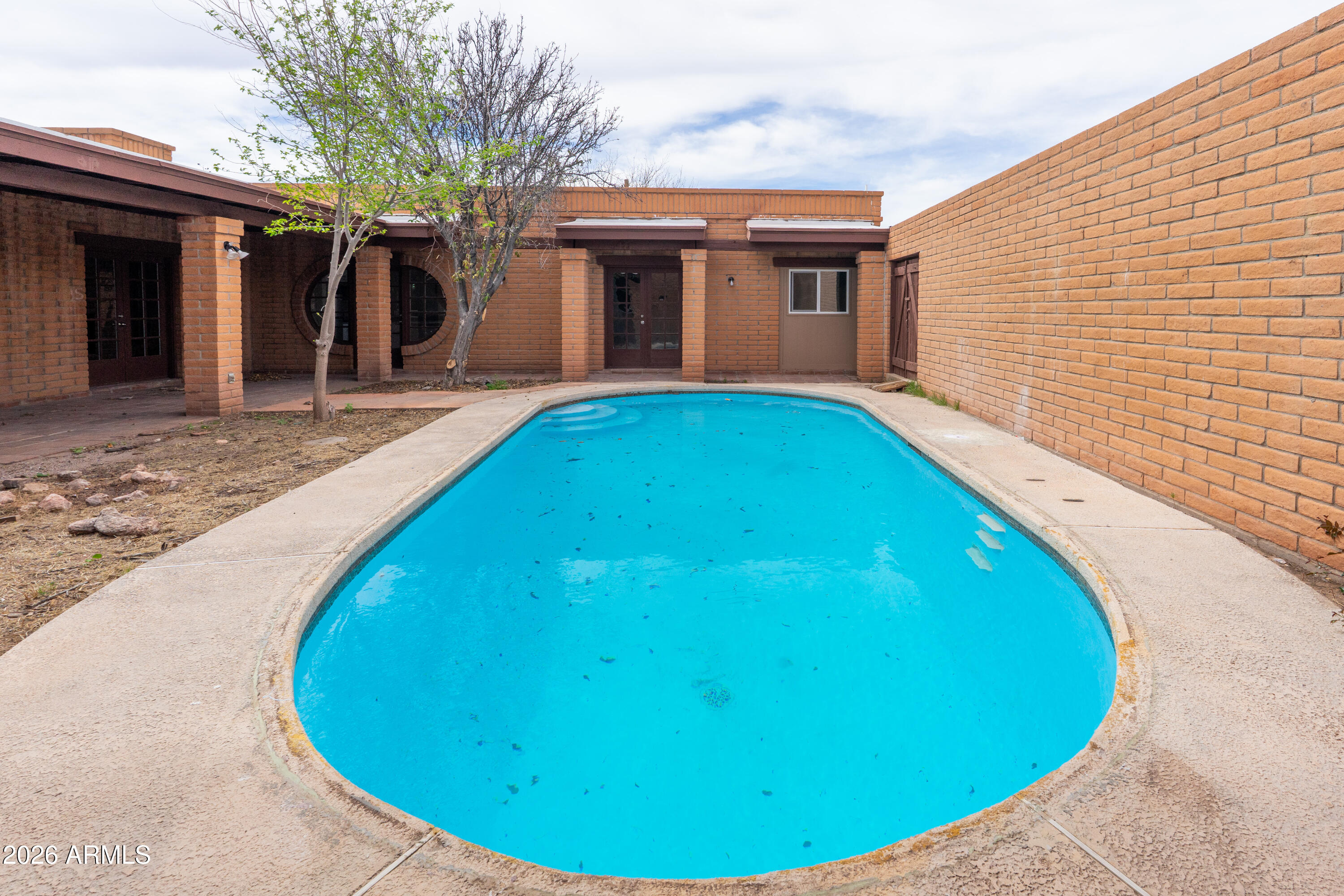 4 Cochise Lane Bisbee, AZ 85603 - Photo 42 of 72 a view of a swimming pool with an chairs