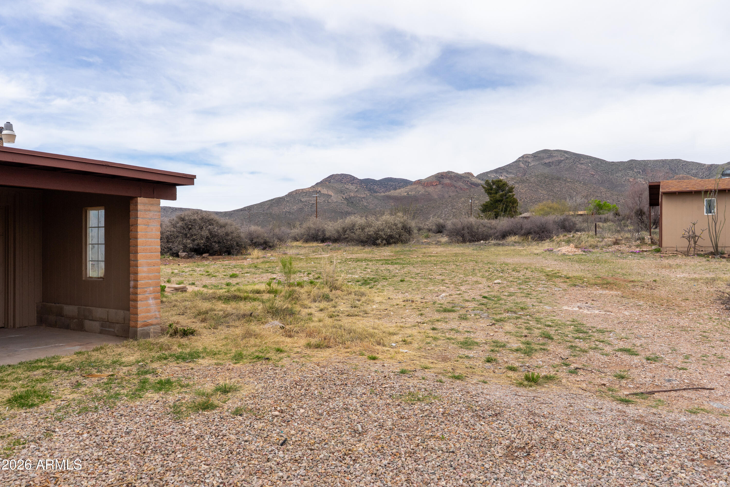 4 Cochise Lane Bisbee, AZ 85603 - Photo 51 of 72 a view of a house with a yard and a large tree