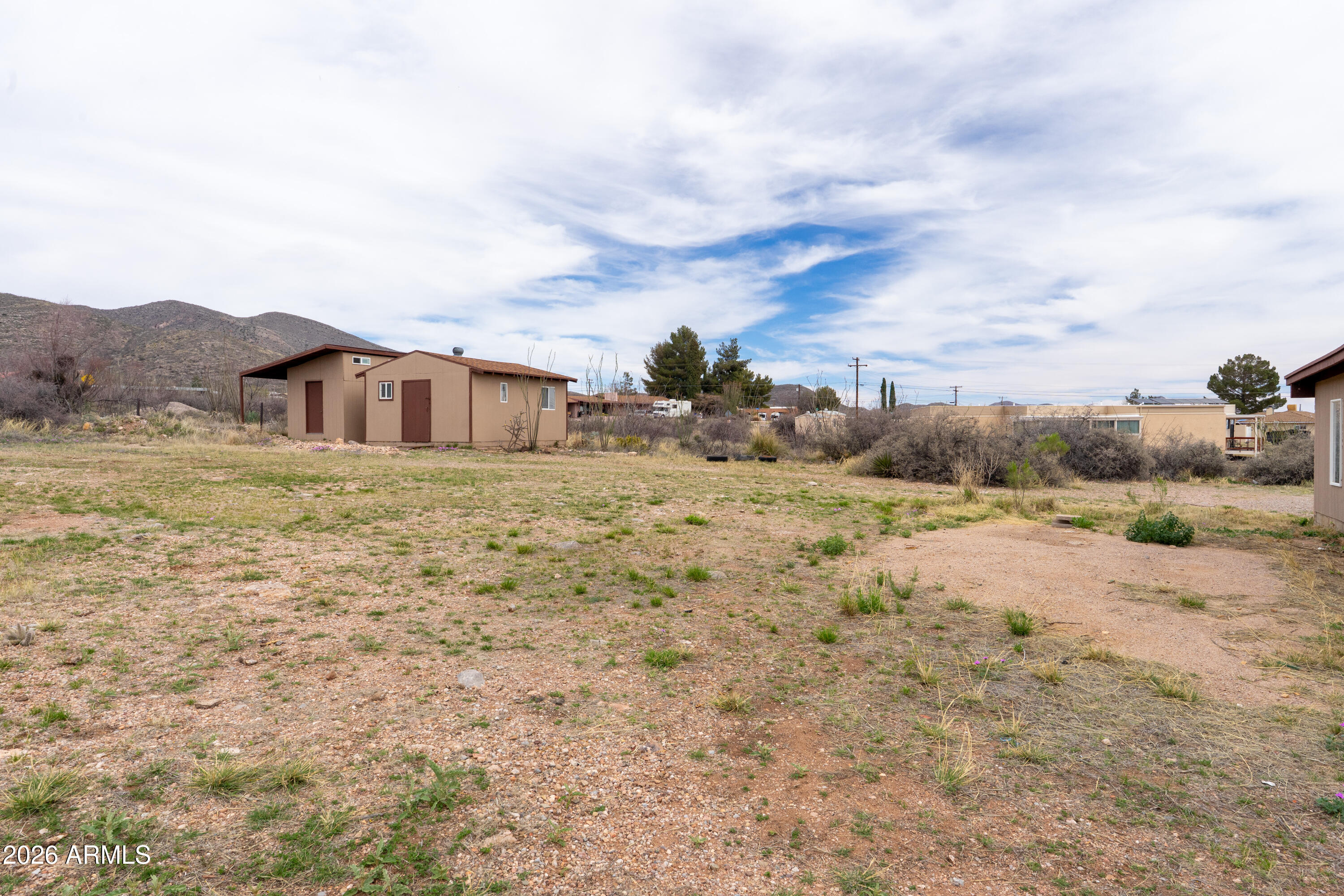4 Cochise Lane Bisbee, AZ 85603 - Photo 53 of 72 a view of a dry yard with wooden fence
