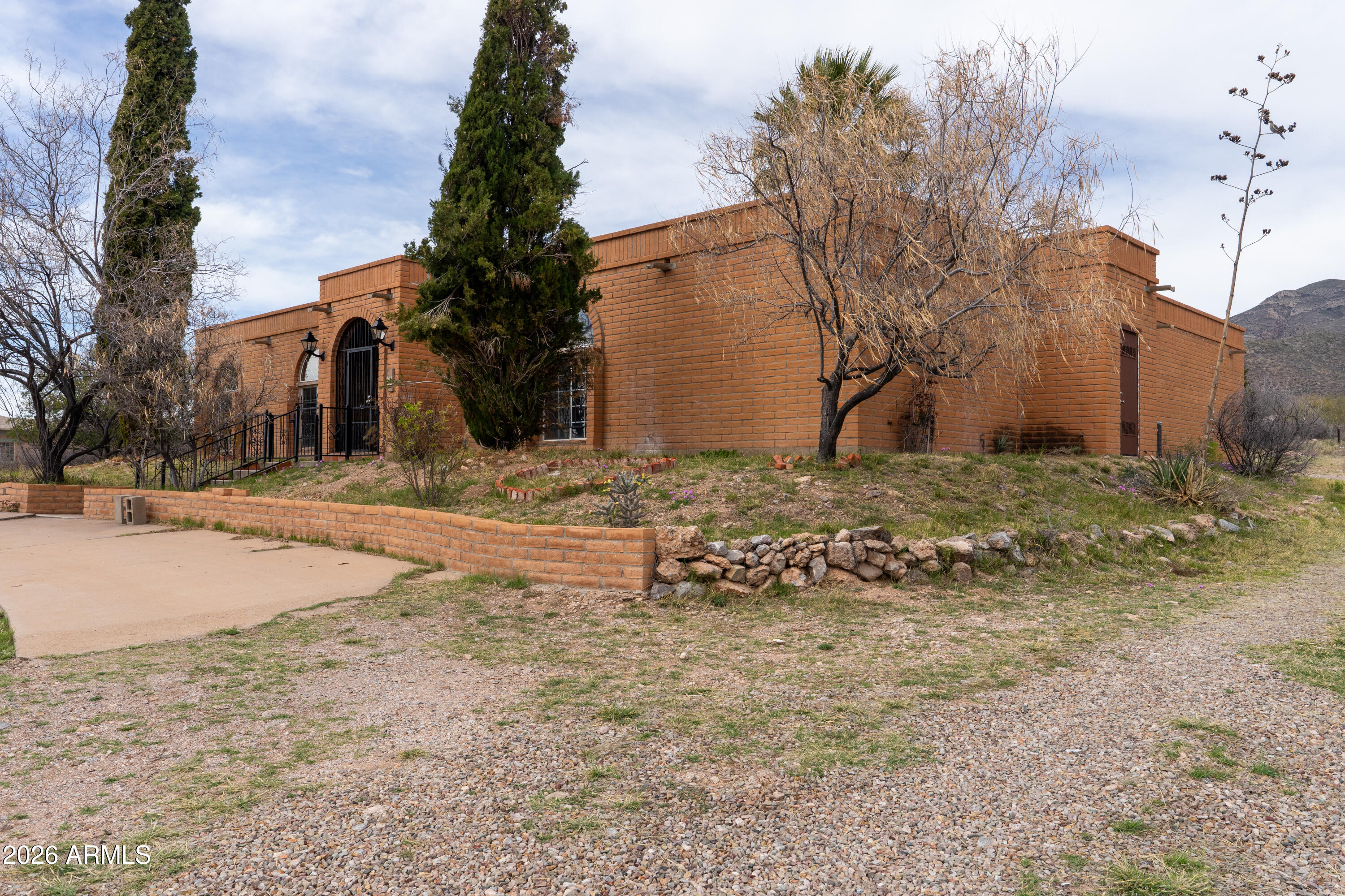 4 Cochise Lane Bisbee, AZ 85603 - Photo 65 of 72 a street view with large trees
