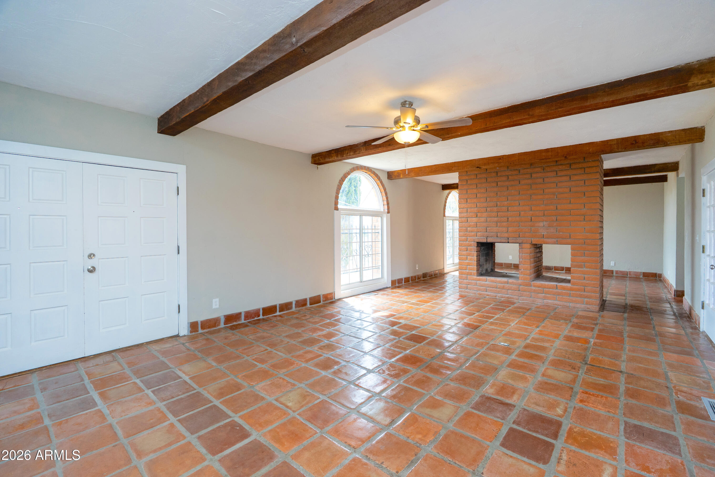 4 Cochise Lane Bisbee, AZ 85603 - Photo 7 of 72 a view of empty room with wooden floor and fan