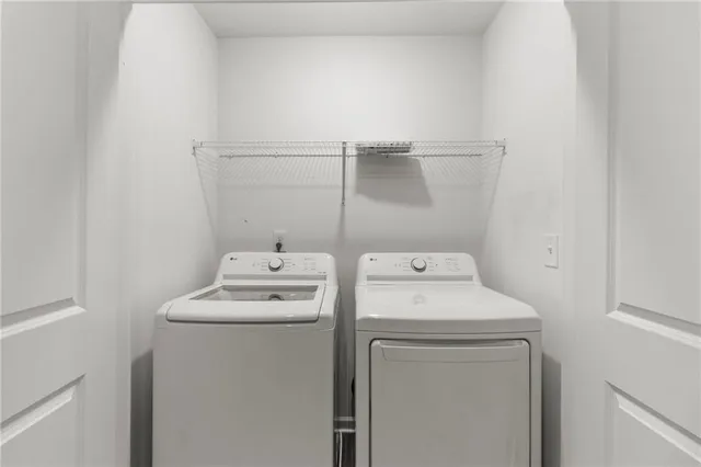 a utility room with dryer and washer