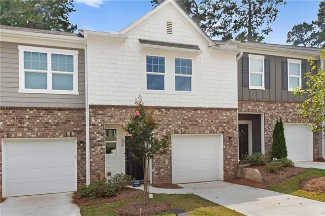 a front view of a house with a garage