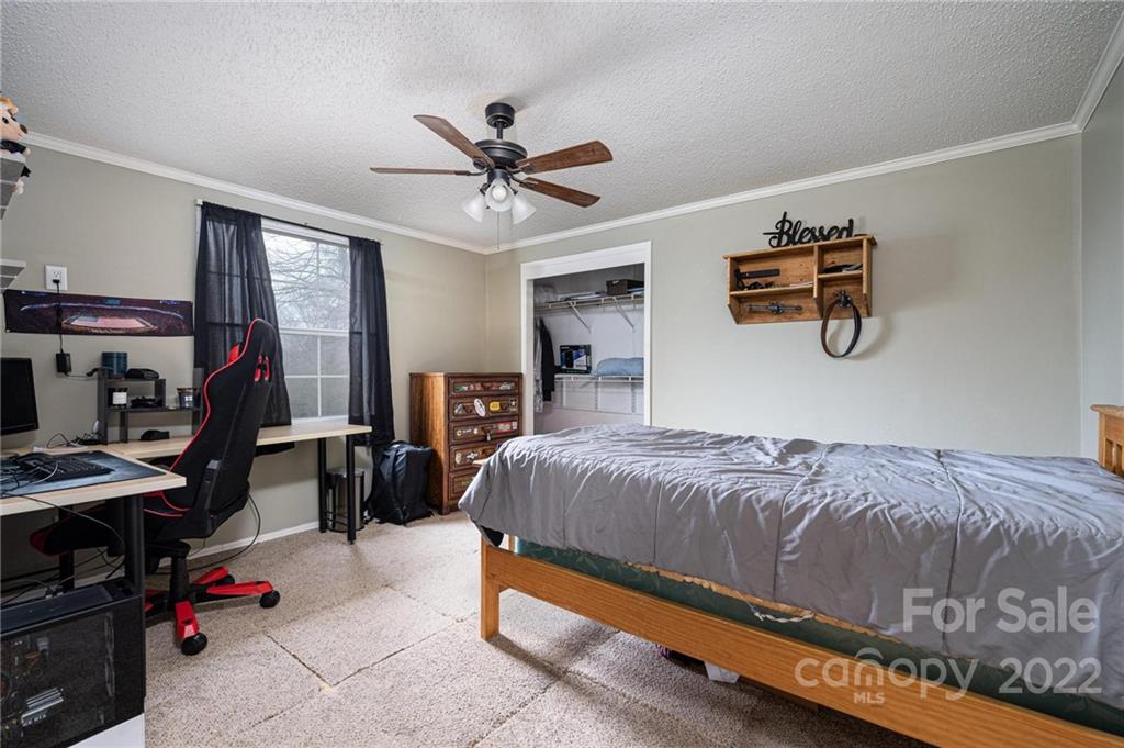 2776 Devine Road Iron Station, NC 28080 - Photo 17 of 23 a bedroom with a bed and a window