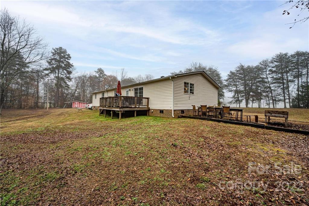 2776 Devine Road Iron Station, NC 28080 - Photo 20 of 23 a view of a house with a yard