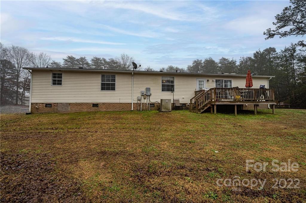 2776 Devine Road Iron Station, NC 28080 - Photo 21 of 23 a house with trees in front of it