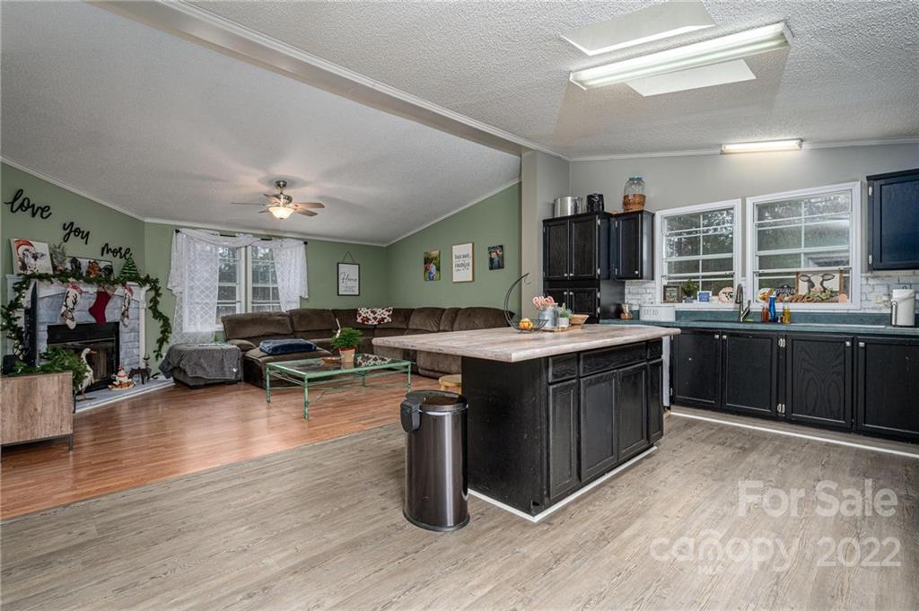 2776 Devine Road Iron Station, NC 28080 - Photo 7 of 23 a kitchen with a sink and cabinets