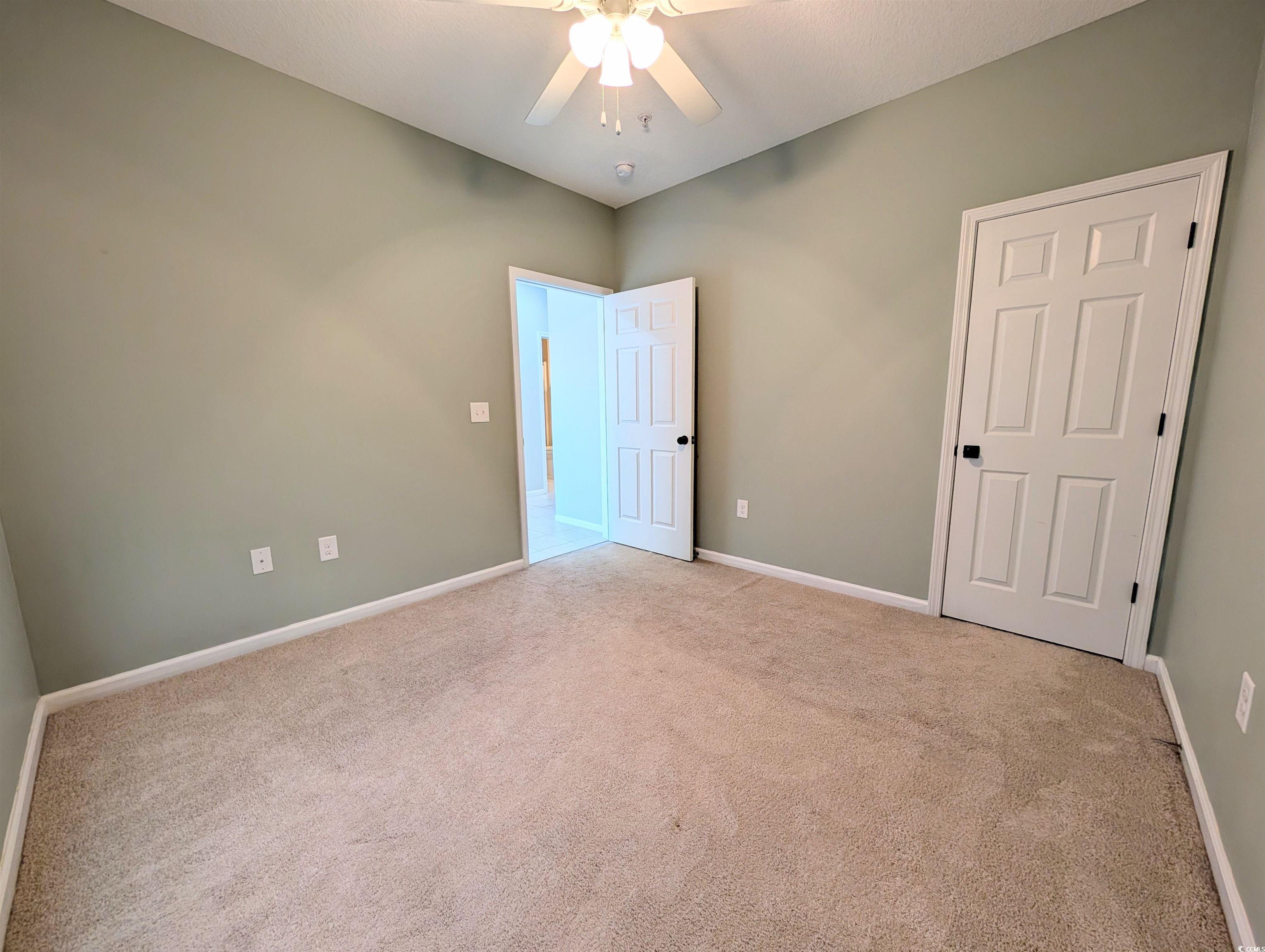 822 Sail Lane Murrells Inlet, SC 29576 - Photo 23 of 34 Unfurnished bedroom with carpet and a ceiling fan