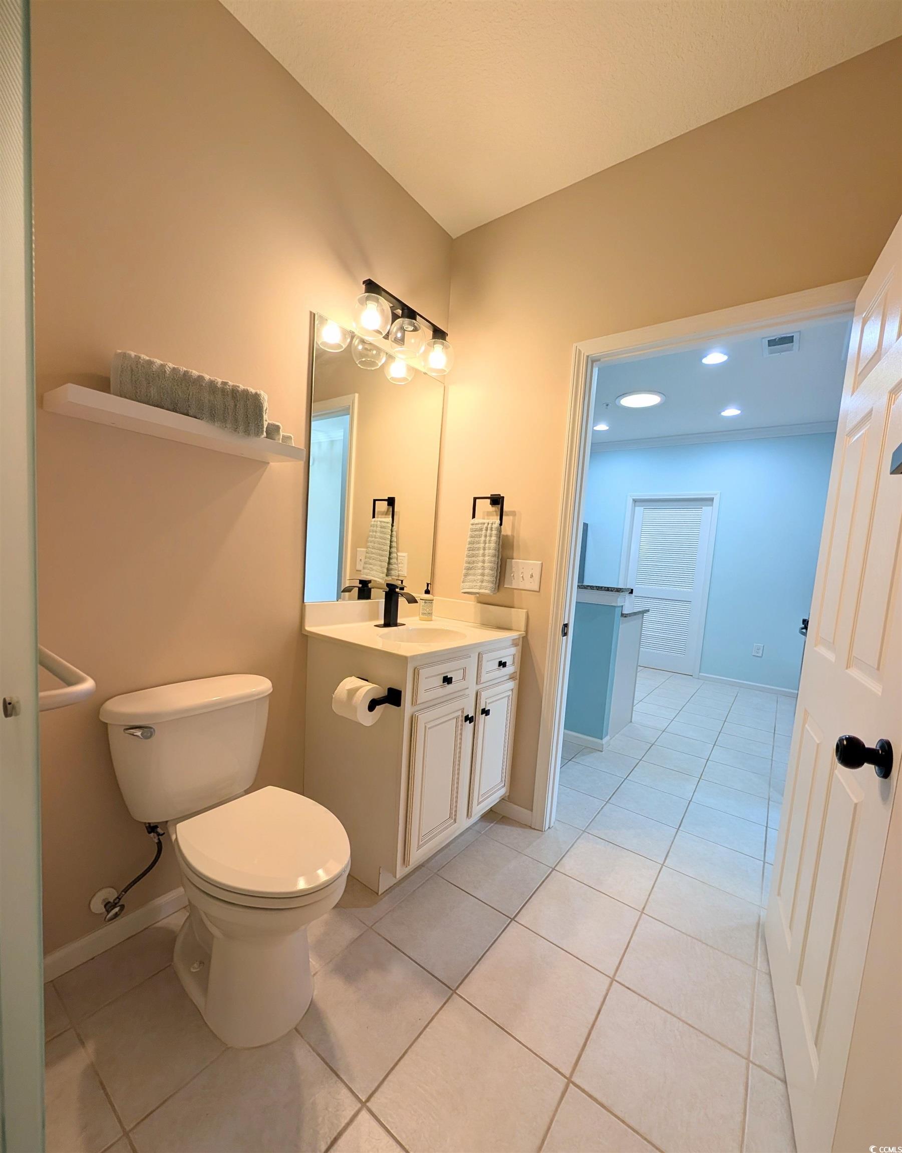 822 Sail Lane Murrells Inlet, SC 29576 - Photo 29 of 34 Bathroom featuring vanity, light tile patterned floors, and recessed lighting