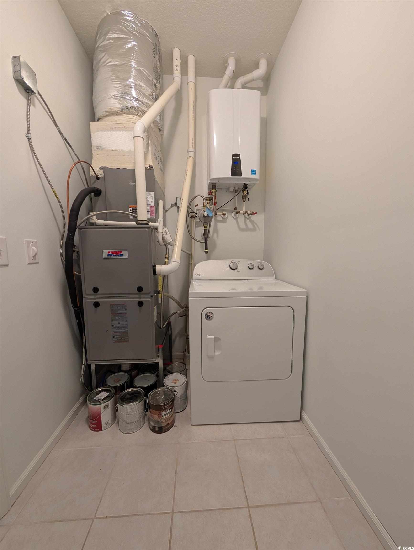 822 Sail Lane Murrells Inlet, SC 29576 - Photo 32 of 34 Laundry area with washer / dryer, light tile patterned floors, a textured ceiling, and heating unit