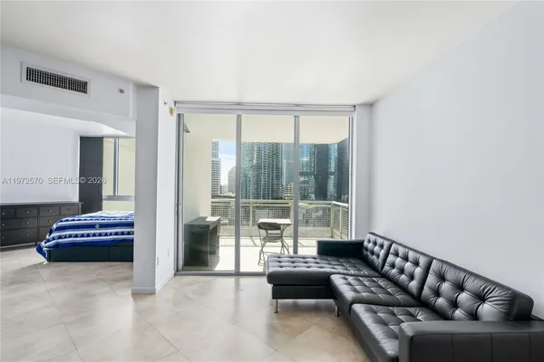 a living room with furniture and a large window