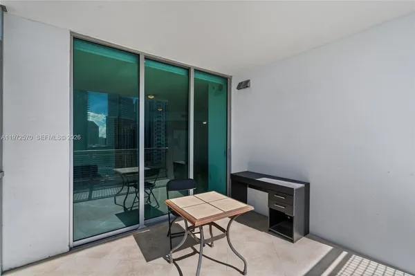 a view of a workspace with furniture