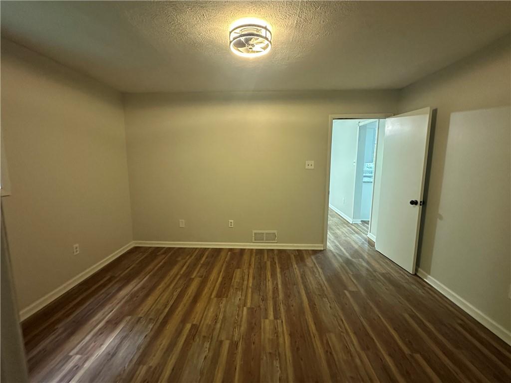 201 Clever Road McKees Rocks, PA 15136 - Photo 11 of 30 an empty room with wooden floor and windows