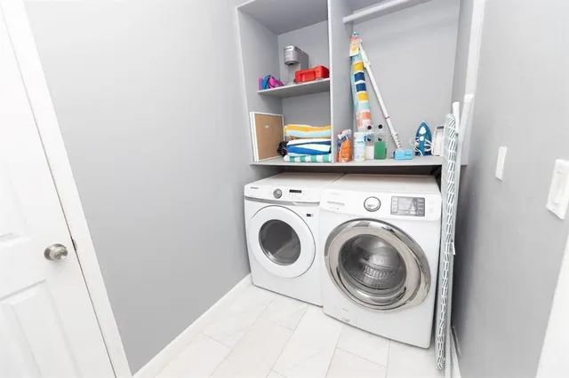 a utility room with dryer and washer