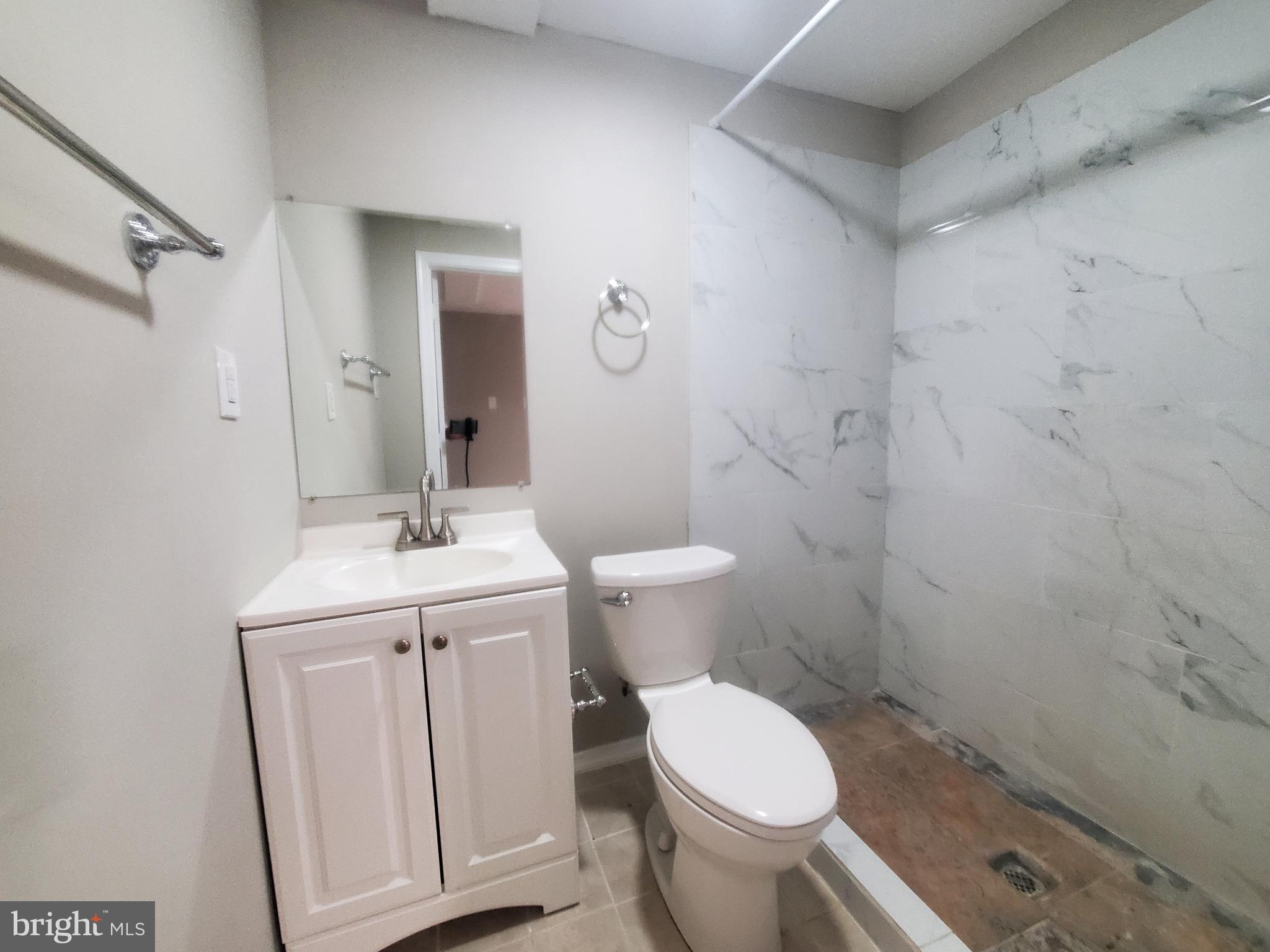 14813 Hammersmith Circle Silver Spring, MD 20906 - Photo 30 of 36 a bathroom with a sink a toilet and shower