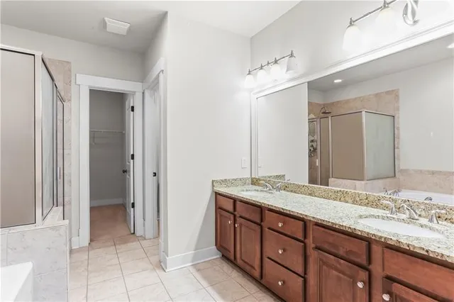 a bathroom with a shower and a bath tub