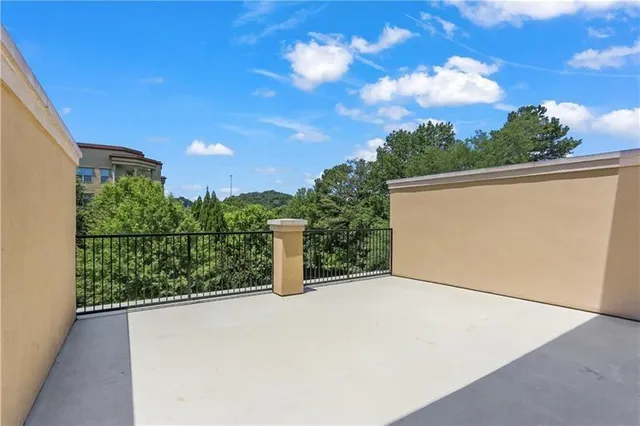 a bathroom with a granite countertop sink toilet mirror and bathtub
