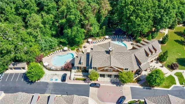 an aerial view of multiple houses with yard