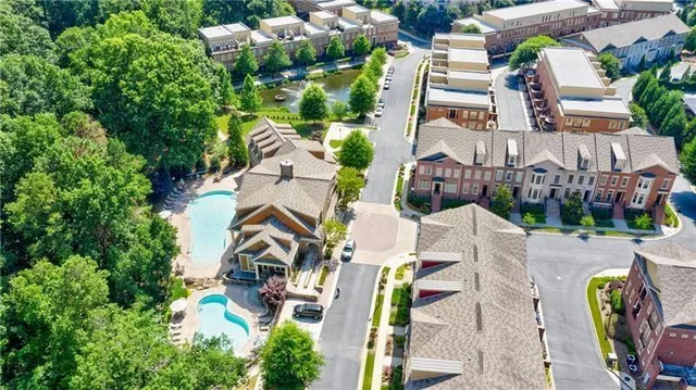 a view of a patio with a table and chairs under an umbrella