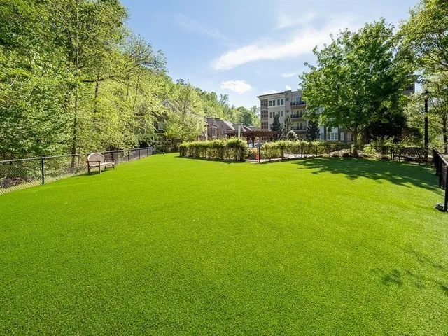 a view of a large yard with lots of green space