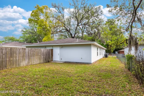 a house with a tree in front of it