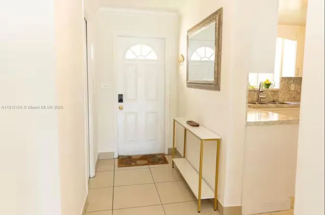 a bathroom with a sink toilet and a mirror
