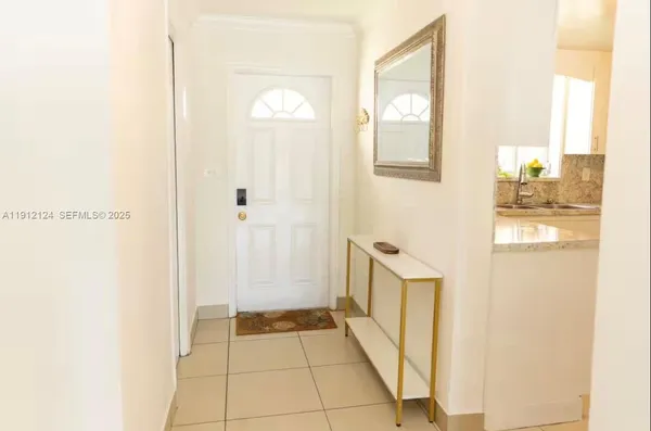 a bathroom with a sink toilet and a mirror