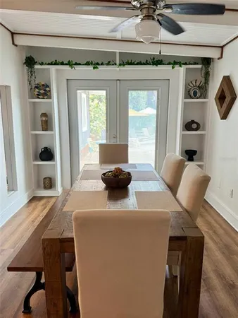 a view of a dining room with furniture and window