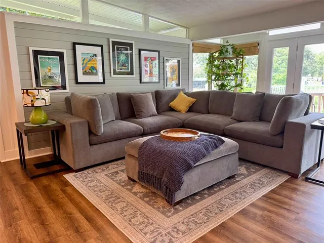 a living room with furniture and a window