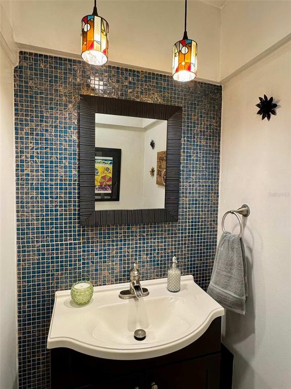 3012 Grand View Avenue Clearwater, FL 33759 - Photo 17 of 43 a bathroom with a sink and a mirror