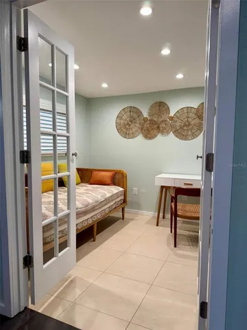 a bedroom with furniture and a window