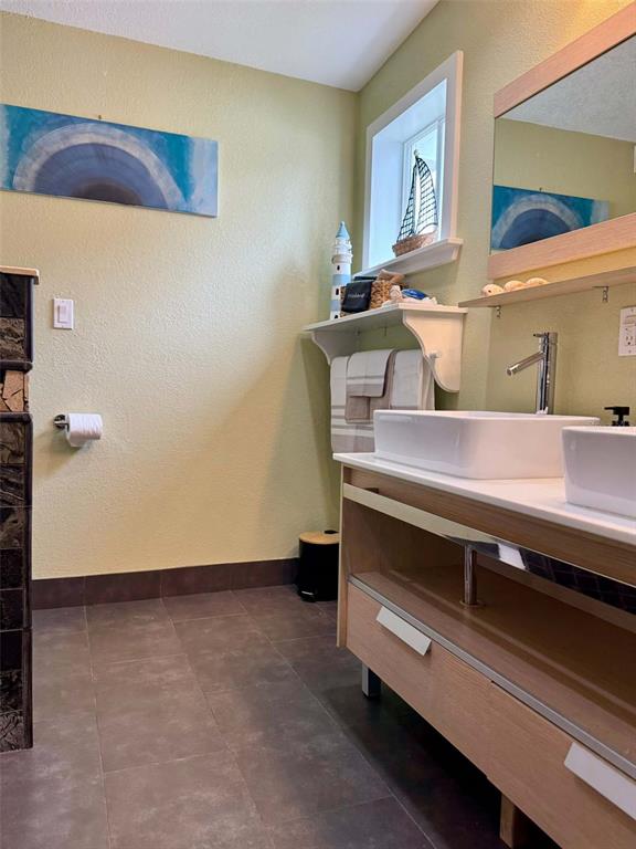 3012 Grand View Avenue Clearwater, FL 33759 - Photo 24 of 43 a view of room with chair and wooden floor