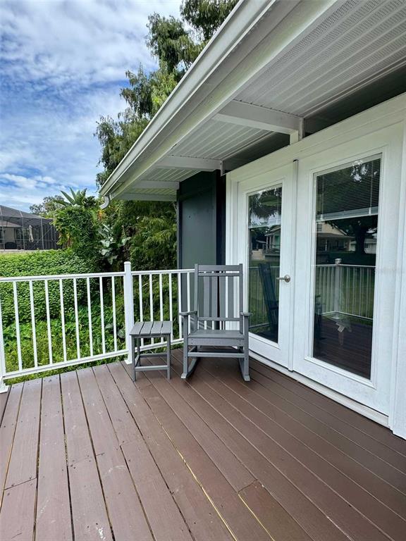 3012 Grand View Avenue Clearwater, FL 33759 - Photo 29 of 43 a view of a chair and tables in the balcony