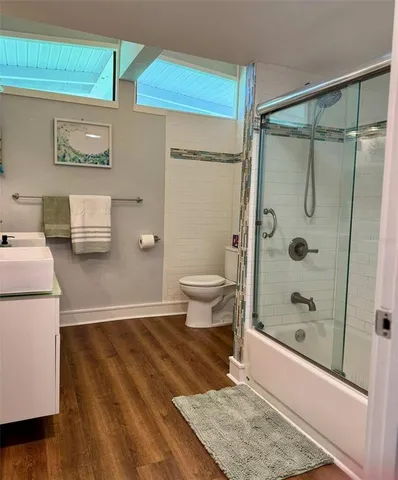 a bathroom with a shower and a toilet
