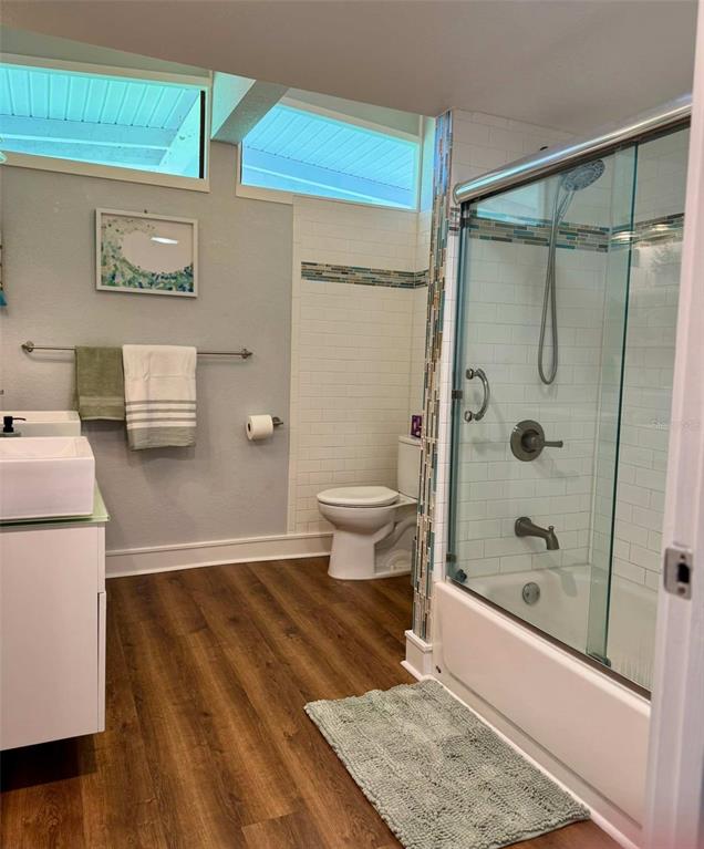 3012 Grand View Avenue Clearwater, FL 33759 - Photo 30 of 43 a bathroom with a shower and a toilet