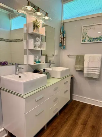a bathroom with a sink and a mirror