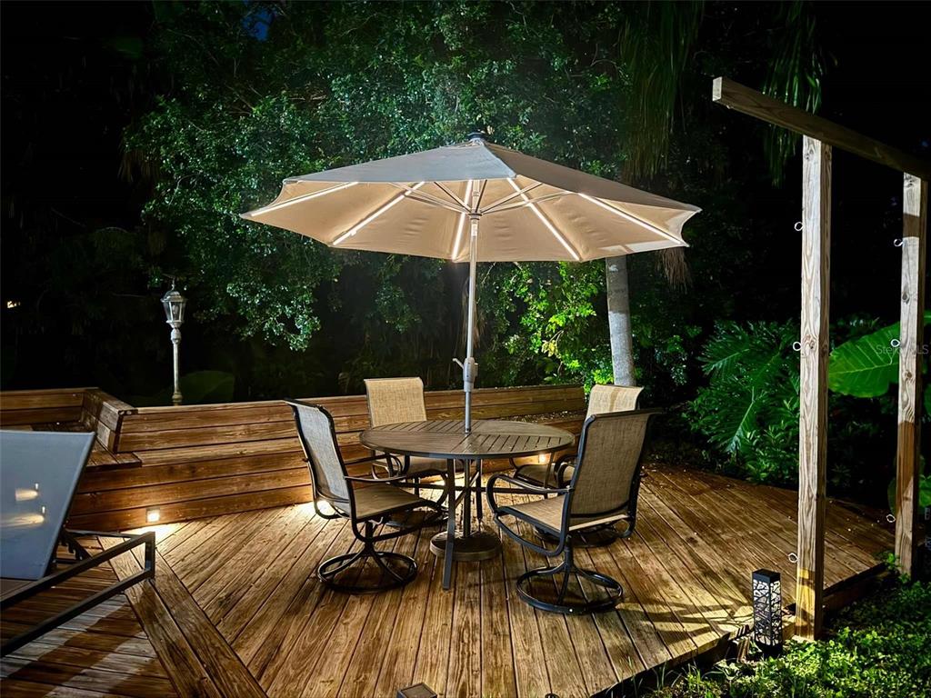 3012 Grand View Avenue Clearwater, FL 33759 - Photo 31 of 43 a view of backyard with seating space and trees