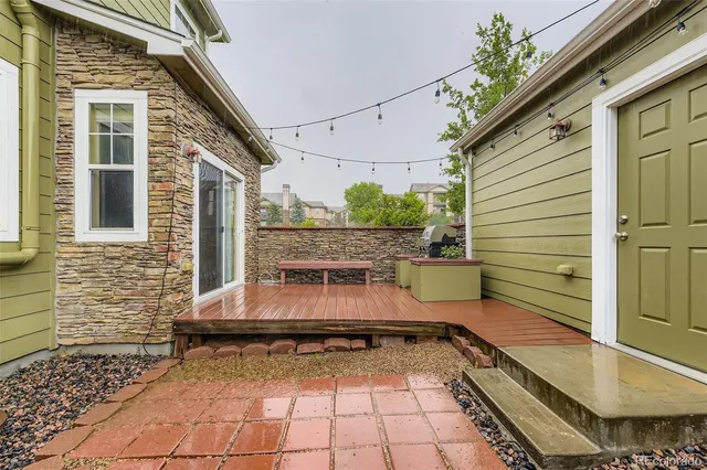 a view of a backyard with sitting area