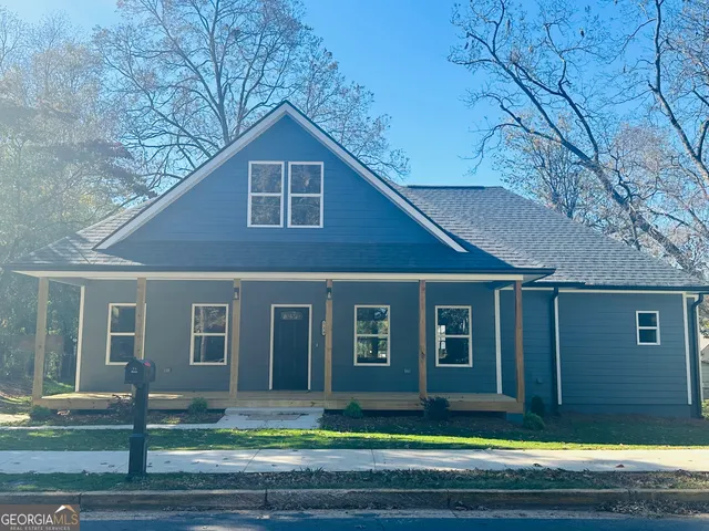 a front view of a house with garage