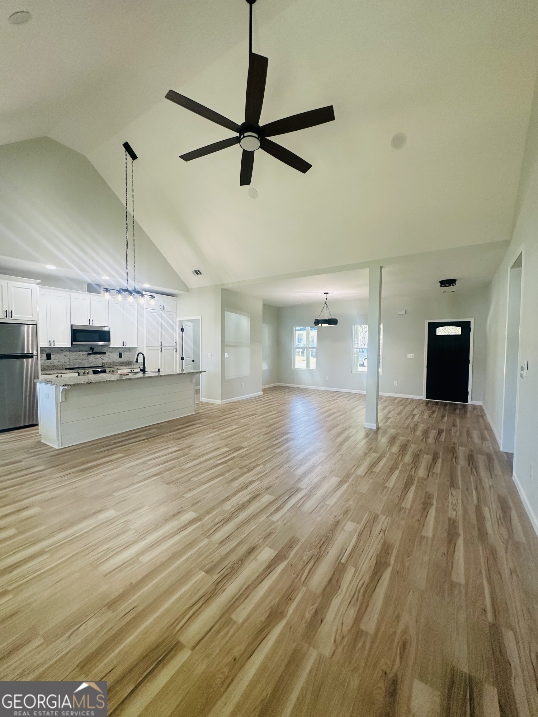 119 F Street Thomaston, GA 30286 - Photo 12 of 27 a view of a kitchen with a sink and wooden floor
