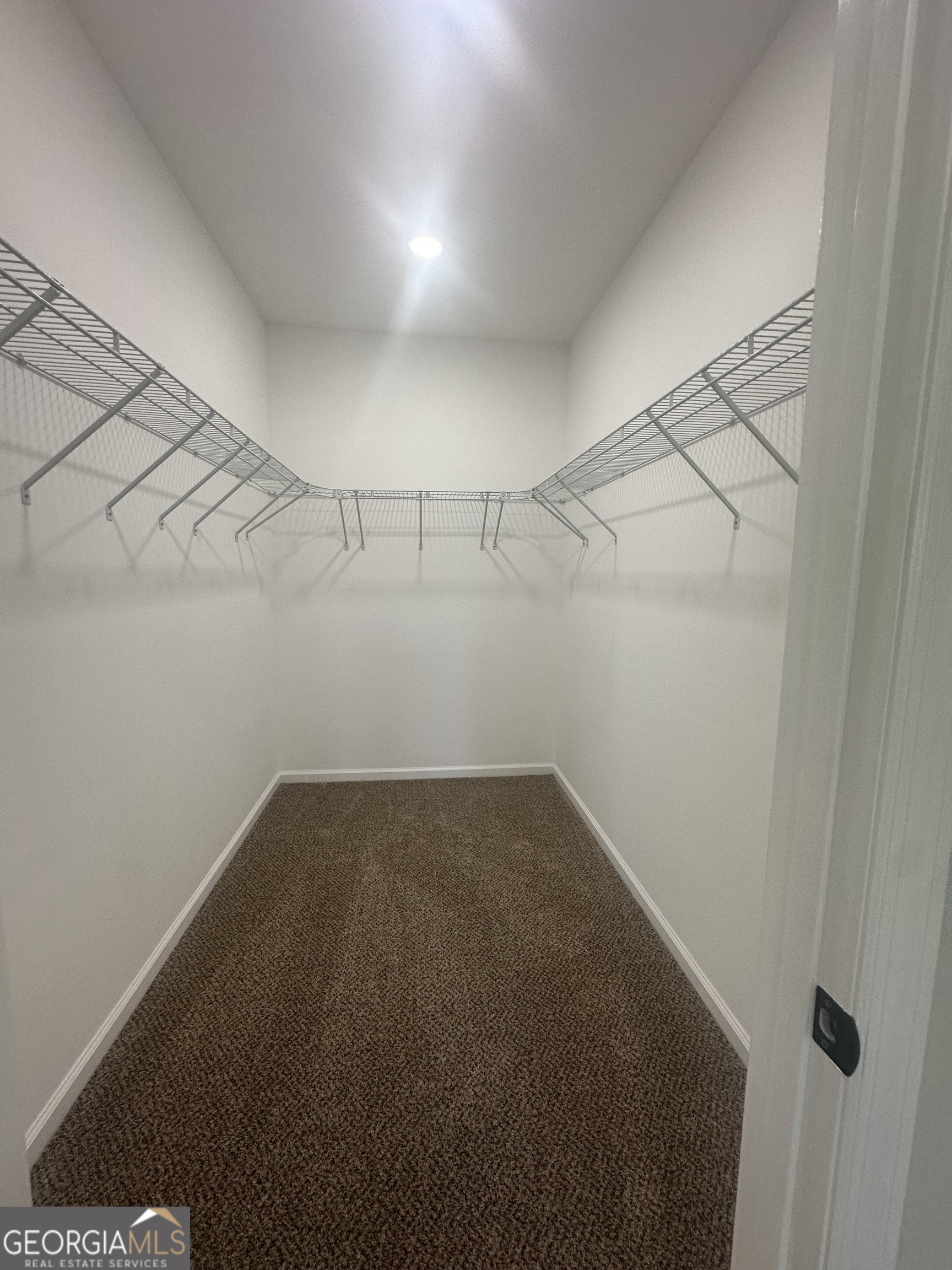 119 F Street Thomaston, GA 30286 - Photo 15 of 27 a view of a room with racks on the wall