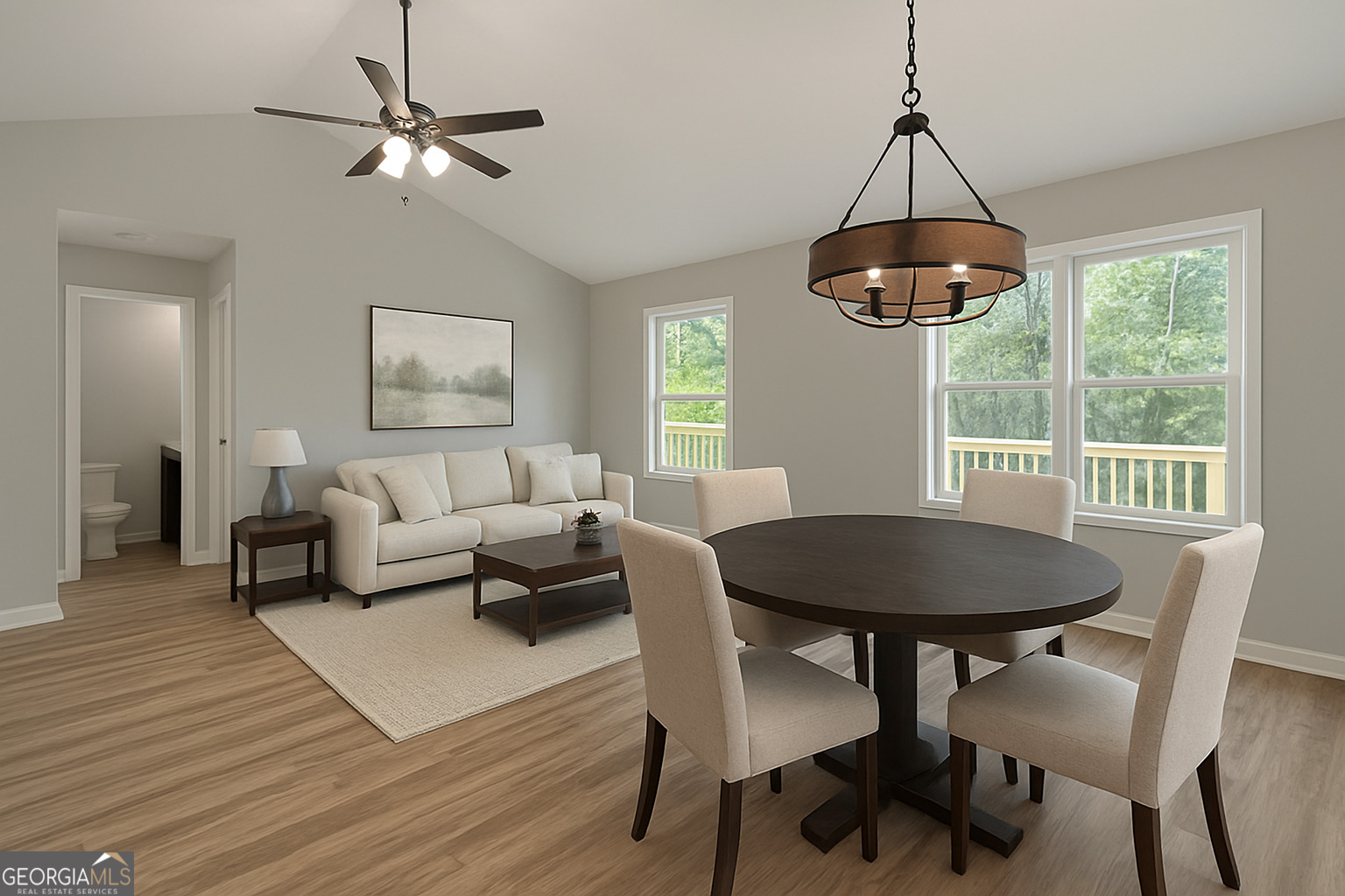 119 F Street Thomaston, GA 30286 - Photo 8 of 27 a living room with furniture a chandelier and a table