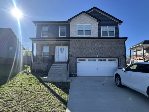 a house view with a backyard space