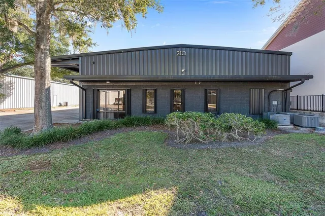 a view of a house with brick walls