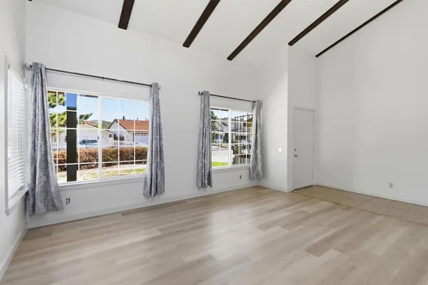 a view of an empty room with a window