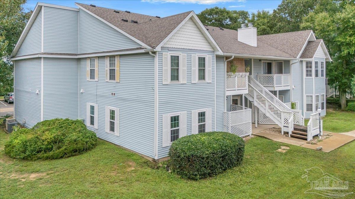 601 East Burgess Road, Unit C3 Pensacola, FL 32504 - Photo 4 of 35 a view of a house with a yard