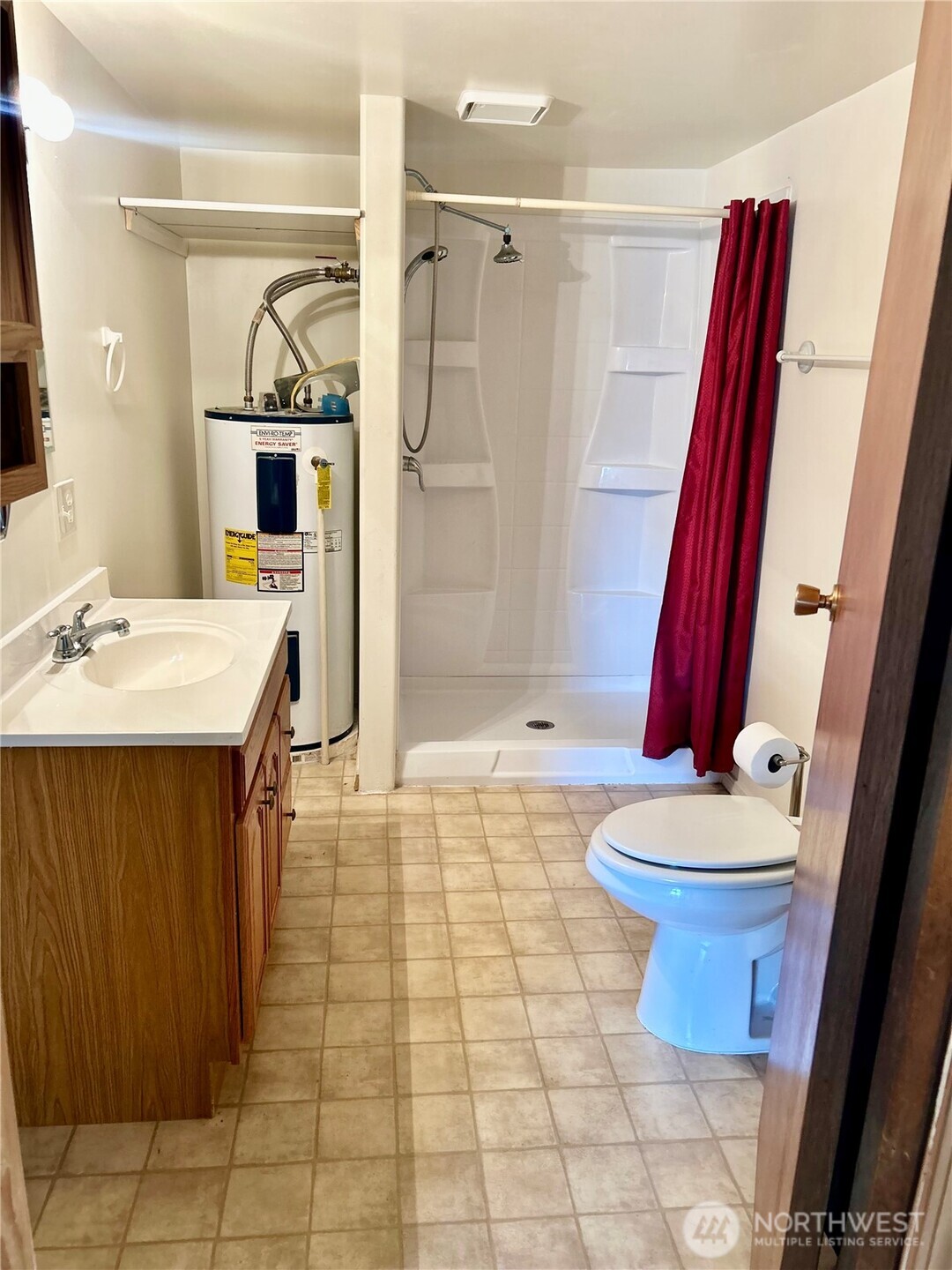 34 Main Street Loomis, WA 98827 - Photo 12 of 18 a bathroom with a sink a toilet and shower