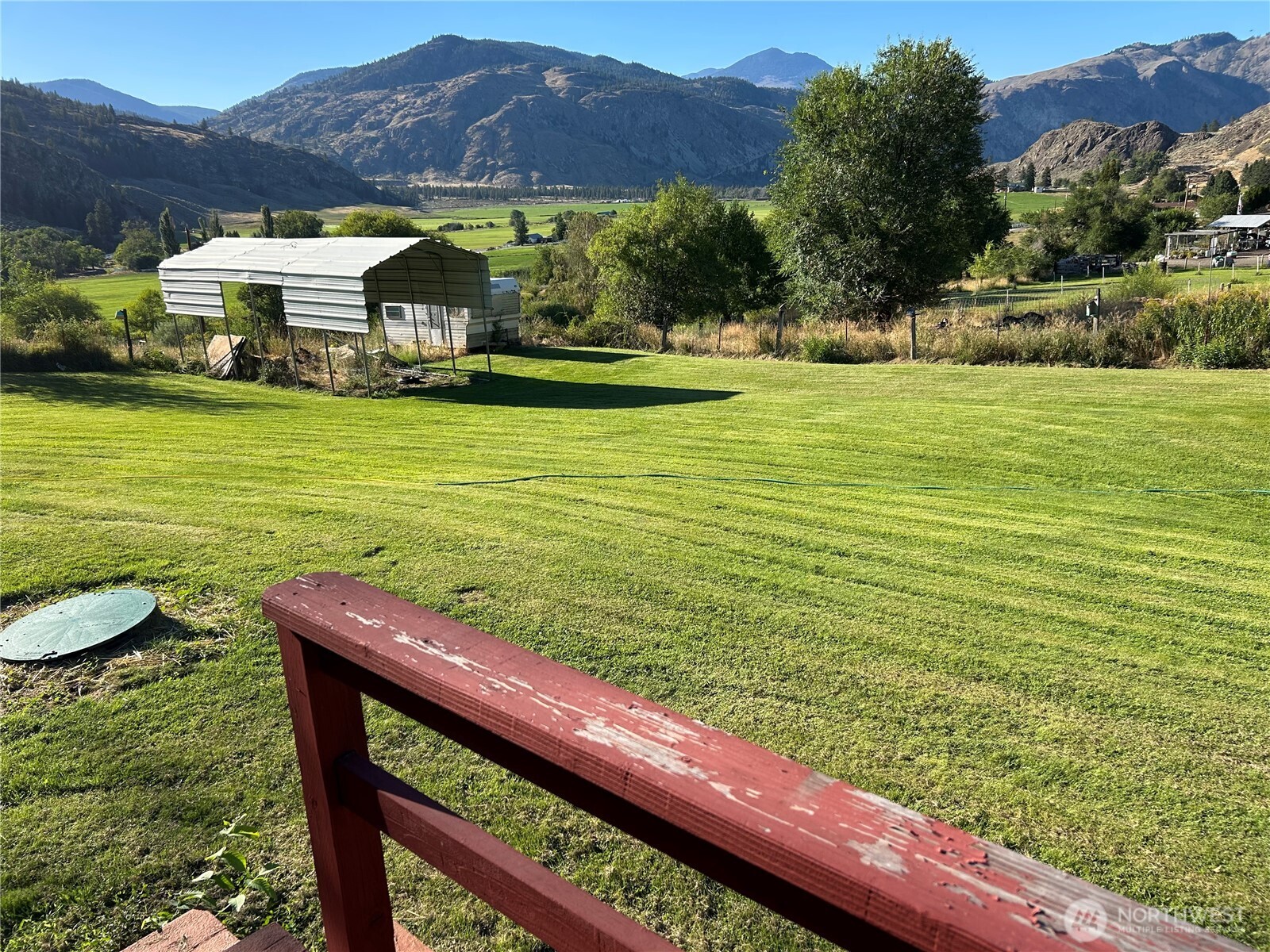34 Main Street Loomis, WA 98827 - Photo 4 of 18 a view of a swimming pool with a patio