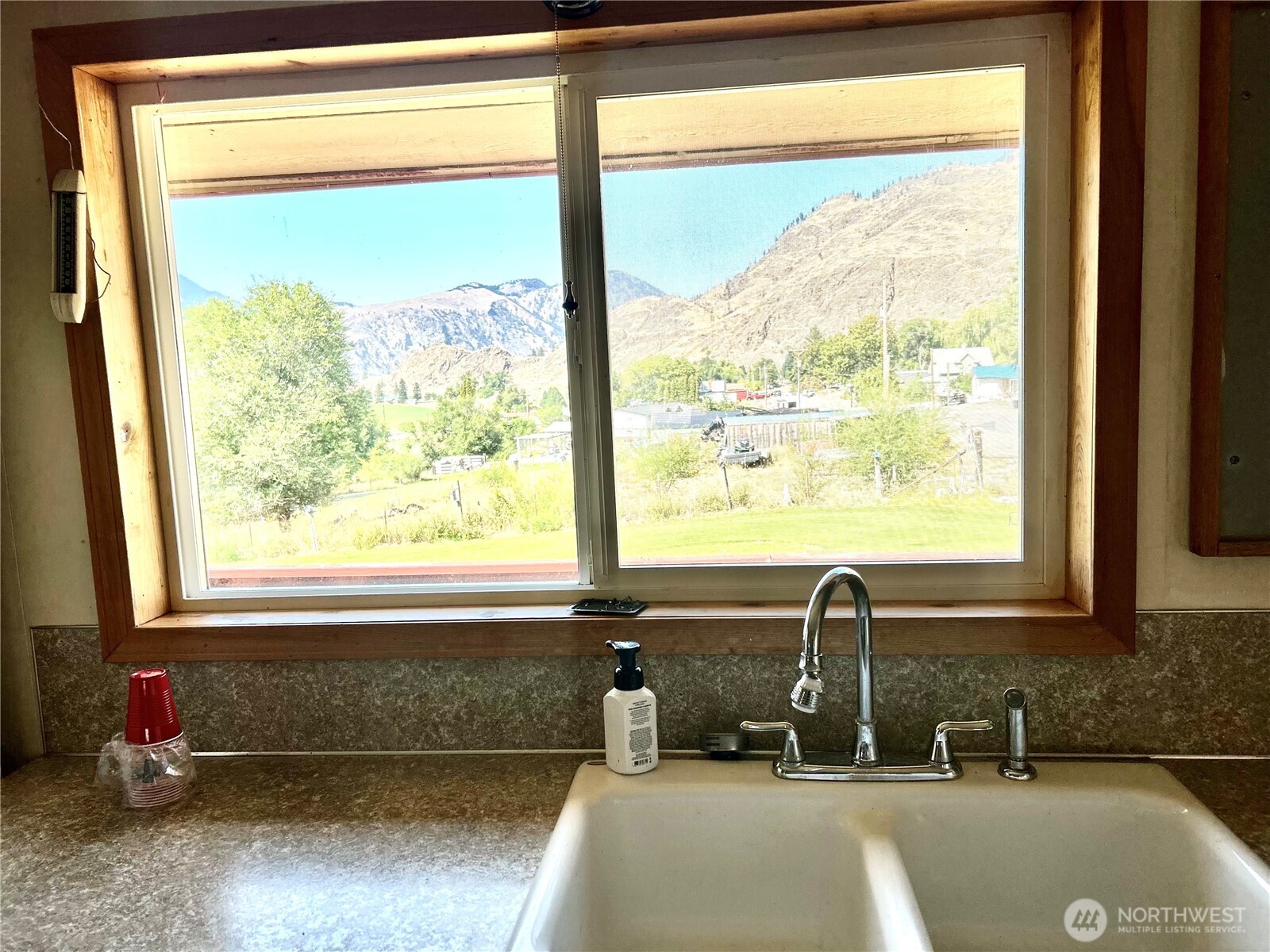34 Main Street Loomis, WA 98827 - Photo 7 of 18 a bathroom with a tub sink and mirror