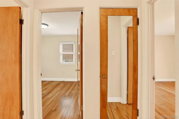 a view of a bathroom from a hallway